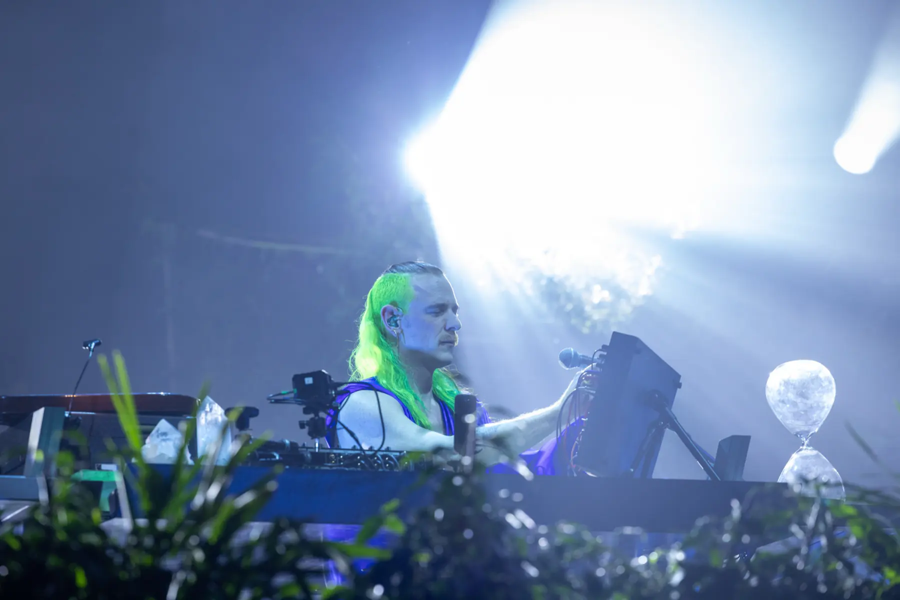 Mace live at the console in a light beam